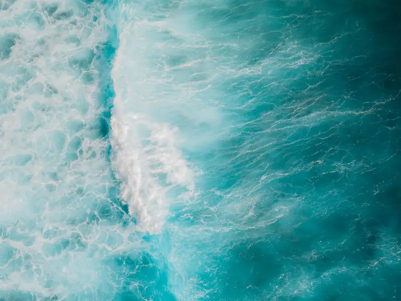 Aerial view of turquoise ocean waves